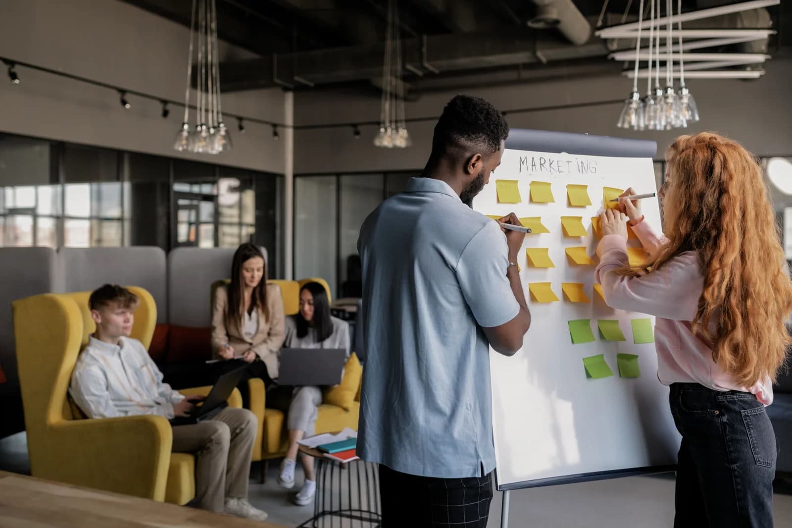 Marketing team planning content on a whiteboard